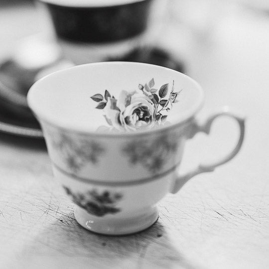 Bone china teacup with decals applied ready to be fired in the kiln