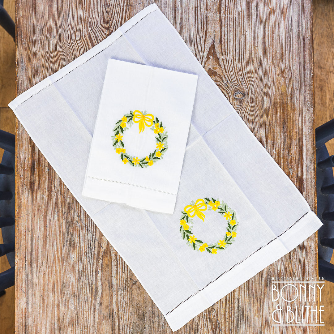 Pair of Embroidered Table Napkins | Yellow Floral Ribbon Wreath